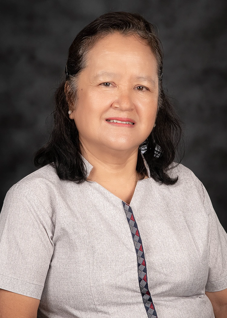 Formal portrait of Ma'am Marilyn, the current school head of CSHSB, wearing the official DepEd uniform against a neutral background.
